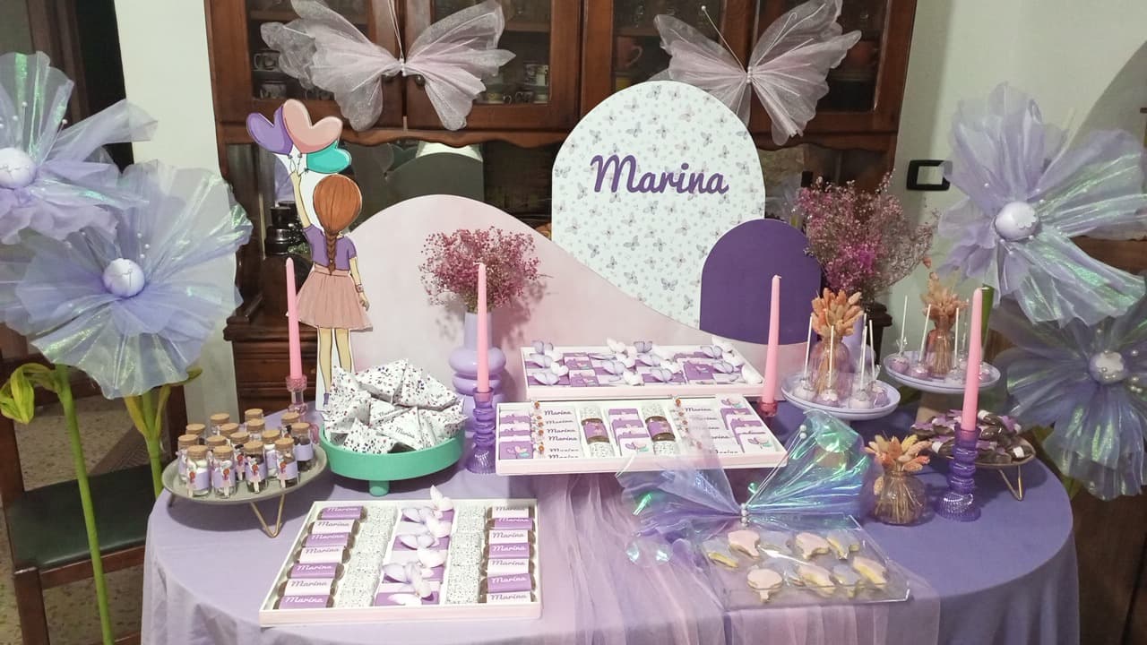 Butterfly themed party table with personalised chocolates